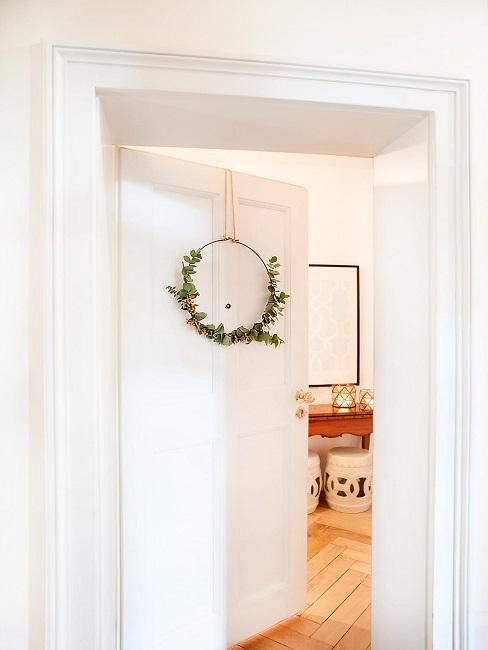 Metal ring decoration hangs on the front door.