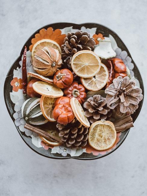Wooden bowl decorate autumn with dried fruits and pine cones