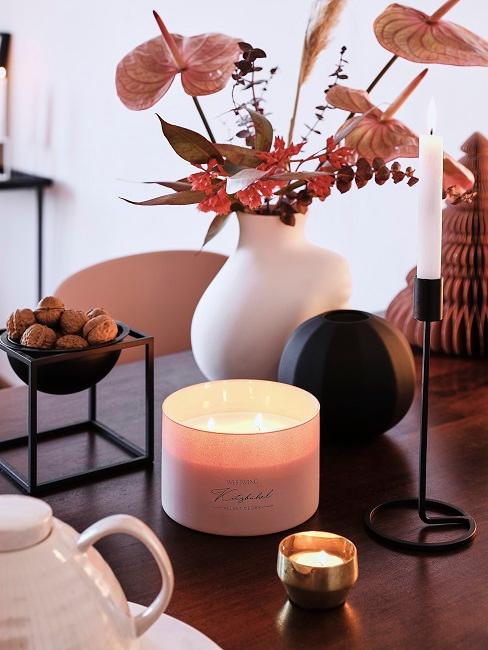 Autumnal calla flower decoration in rose on dining table