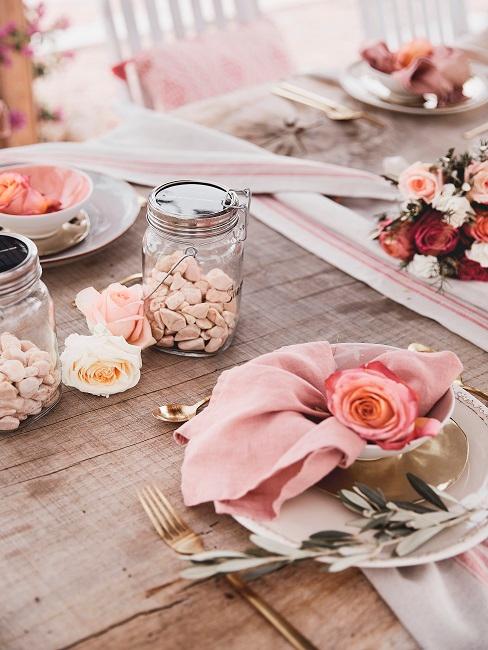 Sun glass with stones on a pink wooden table