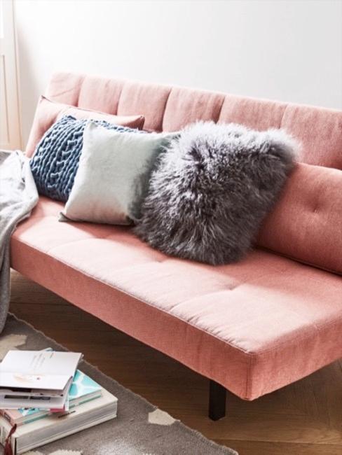 Canapé futon Canapé futon rose avec coussins bleus