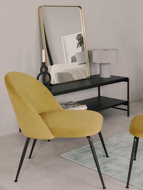 Moderne interieurstijl 5 Moderne interieurstijl Oker gele stoel met zwarte sitetable op grijze vloer