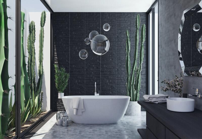 wit/zwartebadkamer met planten en wit ligbad