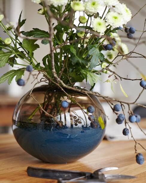 Glazen vaas met bloemen