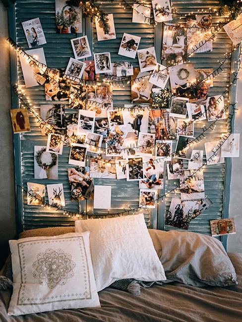 ściana ze zdęciami na której powieszone są światełka