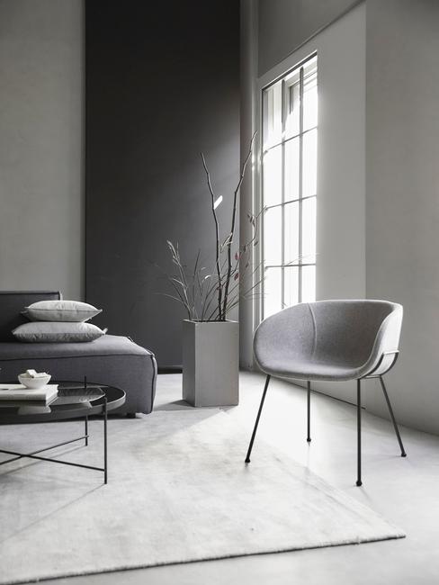 industrieel interieur header industrieel interieur woonkamer grijs bank vloerkleed stoel wanden